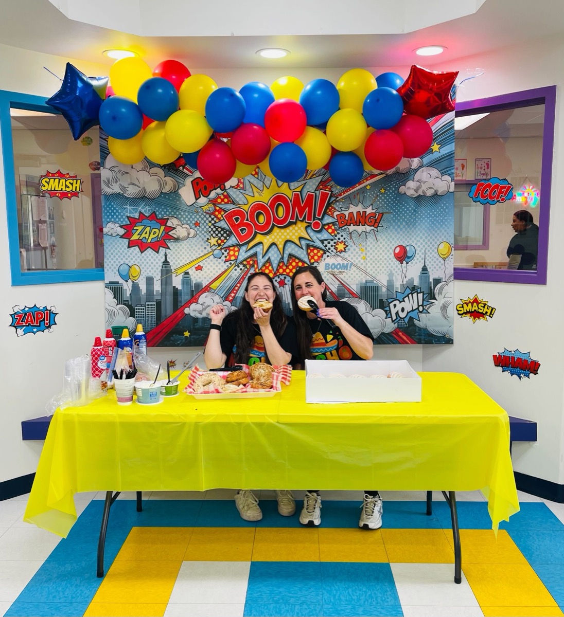 Teachers eating donuts and laughing